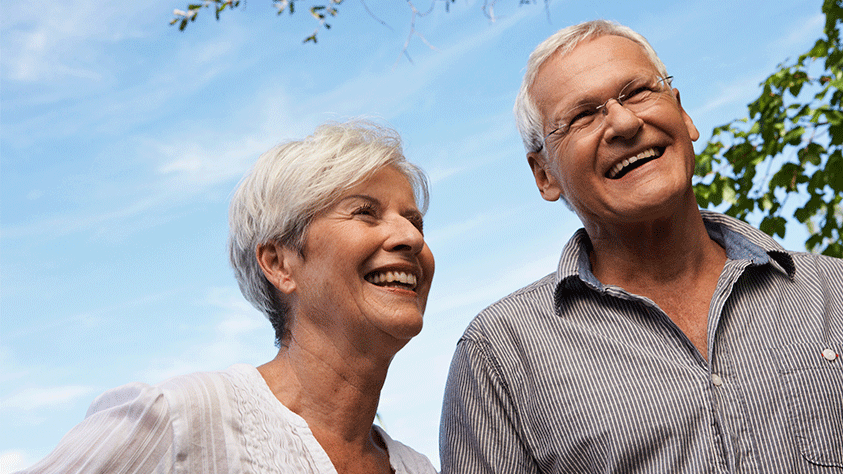 older couple outside smiling